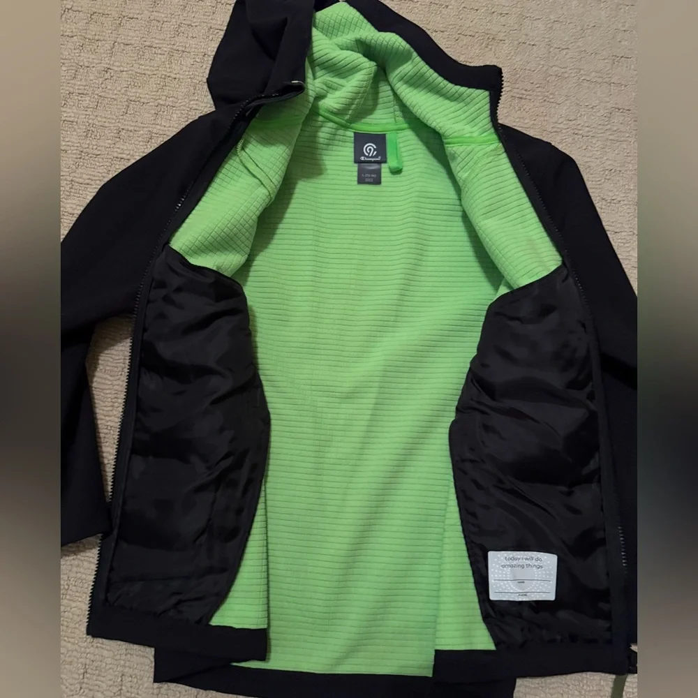 Champion Outdoor Coat/Jacket in black with green accents Boys size L (12/14)